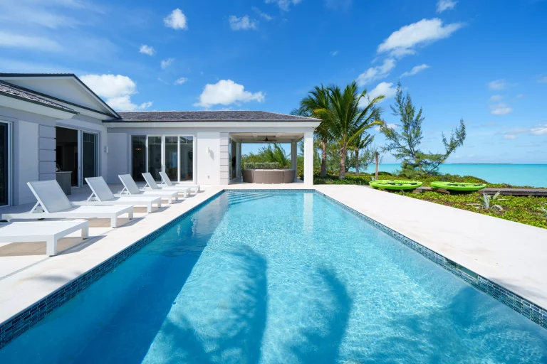 Pool with loungers beside the villa at Seaclusion, George Town, Great Exuma