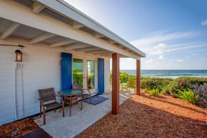 Porch with chairs and ocean view at Ocean Side Rooms, Hope Town, Elbow Cay